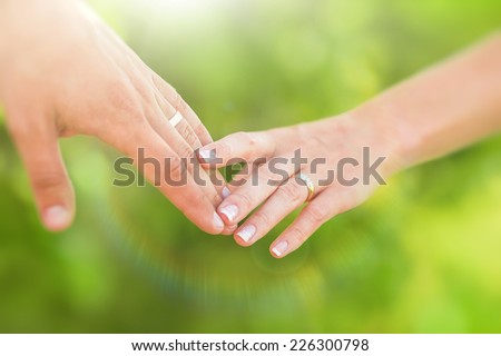 Hands of married man and woman