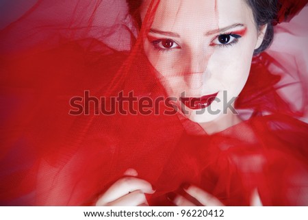 Beautiful girl in red tulle