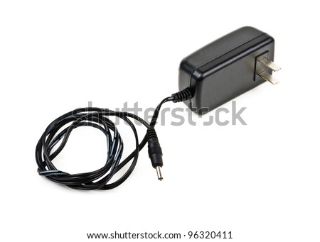 AC adapter for charging the phone. Photos isolated on white background