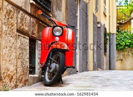 Old, red vintage motor scooter in Palma de Mallorca