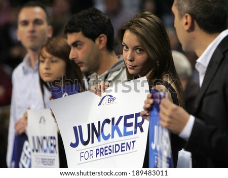 SOFIA, BULGARIA - APRIL 27: Supporters of EPP holds boards with name of candidate for the post of EC Pres Jean-Claude Juncker during opening of the European elect campaign on April 27, 2014 in Sofia.