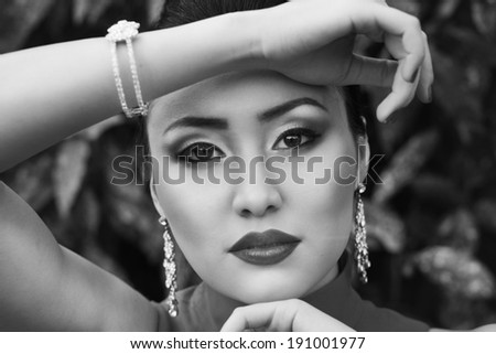 Black and white portrait of young asian female