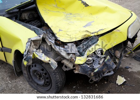 Traffic accident. Yellow crashed car