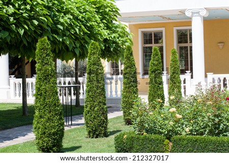 Beautiful garden in front of a villa house