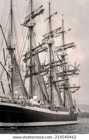 Old ship with white sales in black and white