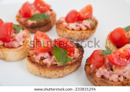 Delicious bruschetta (Italian Toasted Garlic Bread ) with ham and cherry tomato