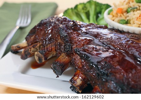 Rack of pork ribs on plate.