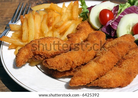 A fried chicken finger dinner on plate