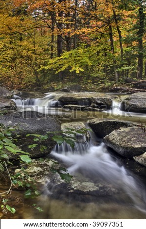 Autumn stream and waterfalls along Stony Brook in the white mountains of New Hampshire.
