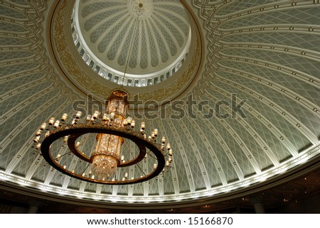 Chandelier and decorated ceiling in a mosque