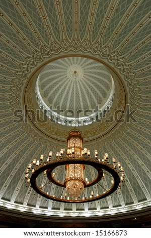 Chandelier and decorated ceiling in a mosque