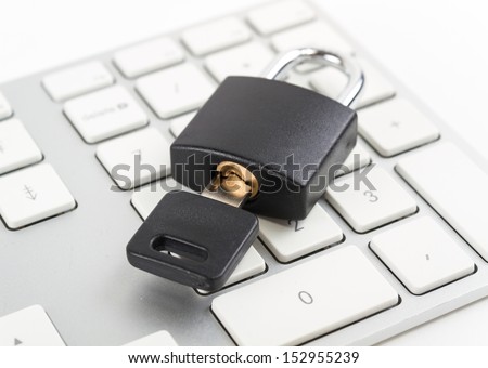 Security Concept. Lock with key on the keyboard.