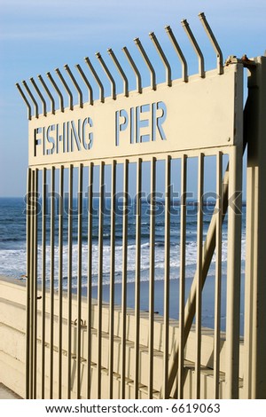 Open gate on a fishing pier; Ocean Beach; San Diego, California.