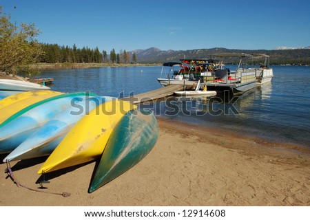 Canoes on lake shore; Big Bear Lake, California
