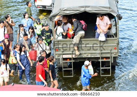 BANGKOK, THAILAND-NOVEMBER 12: Transportation of people in the streets flooded after the heaviest monsoon rain in 20 years in the capital on  November 12, 2011 Phahon Yothin Road, bangkok, Thailand.