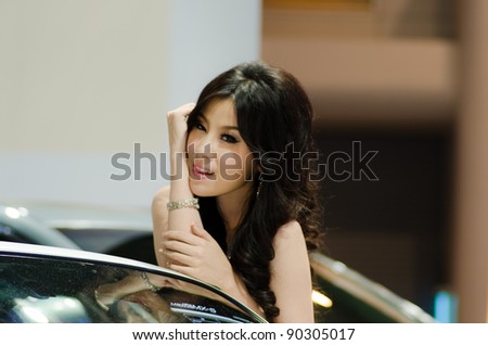 BANGKOK, THAILAND - DECEMBER 6: Unidentified female presenter at Mazda booth in THE 28th THAILAND INTERNATIONAL MOTOR EXPO 2011 on December 6, 2011 in Bangkok, Thailand.
