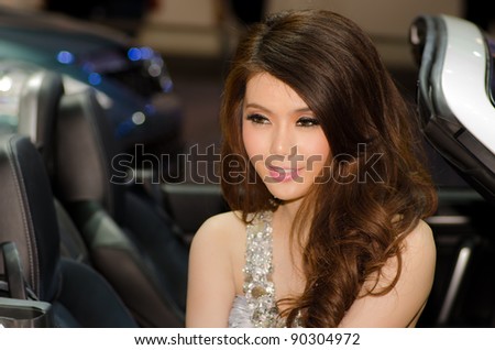 BANGKOK, THAILAND - DECEMBER 6: Unidentified female presenter at Mazda booth in THE 28th THAILAND INTERNATIONAL MOTOR EXPO 2011 on December 6, 2011 in Bangkok, Thailand.