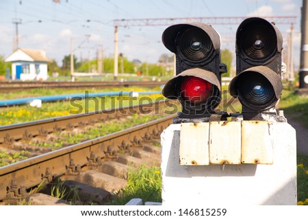 Traffic light shows red signal on railway. red light