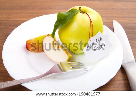 dieting and health food. Yellow, green apple with leaf, tape and sticker