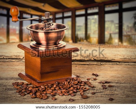 coffee beans and old coffee mill in shop, cafe