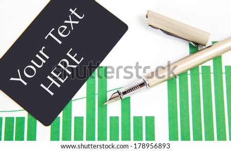 a pen and business card on the business papers