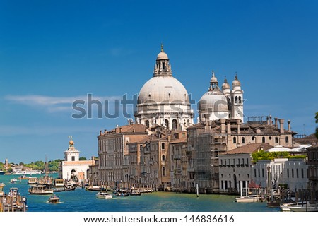 Venice, Basilica di Santa Maria della Salute and the canal water typical summer tourist traffic