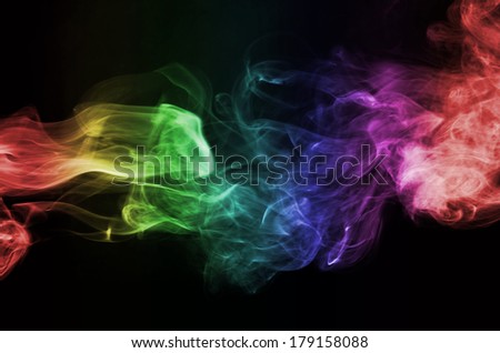 Colorful smoke clouds close up. Whole black background.