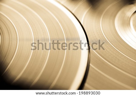 Segment of vinyl record with label showing the texture of the grooves, retro look