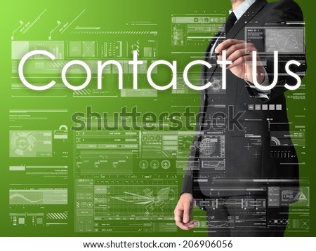 businessman writing Contact Us and drawing graphs and diagrams on green background