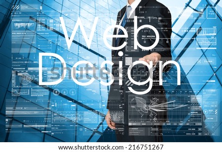 businessman presenting Web Design text, graphs and diagrams with skyscraper in background, business concept