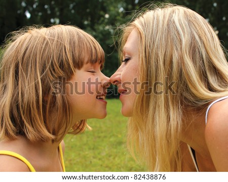 Mom and daughter kissing noses