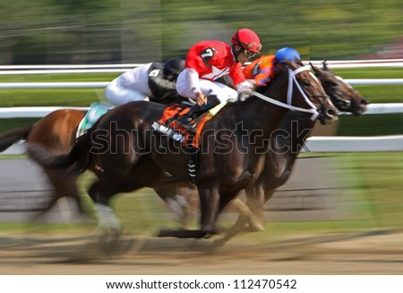 SARATOGA SPRINGS - AUG 31: Jockey Joel Rosario and Tarmarind Hall compete in The Big Bambu Stakes at Saratoga Race Course on Aug 31, 2012 in Saratoga Springs, NY.