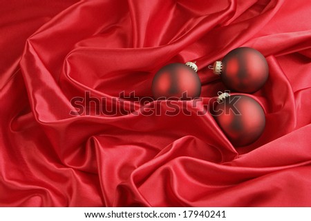 Red Ornaments on Red Satin Background