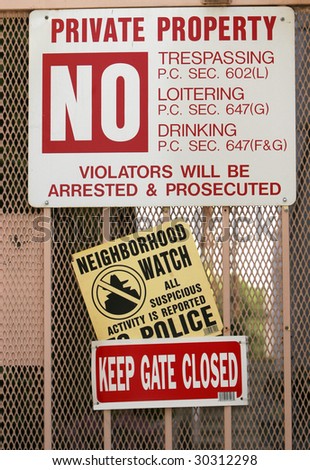 Security signs on a Los Angeles, CA apartment house.