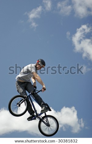 MILFORD, CT - AUG 18: A BMX stunt biker demonstrates his skills at an Eastern Action Sports Teams demonstration in Milford, Connecticut, on August 18, 2008.