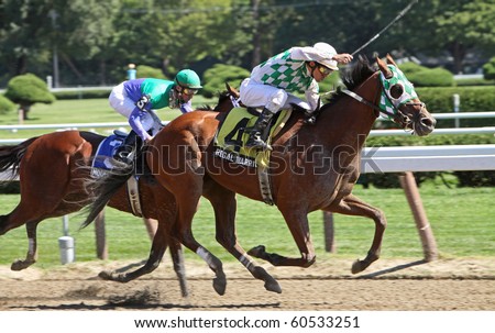 SARATOGA SPRINGS, NY - AUG 27: Ramon Dominguez urges Regal Warrior to a third-place finish in The Pleasant Colony Stakes at Saratoga Race Course on Aug 27, 2010 in Saratoga Springs, NY.