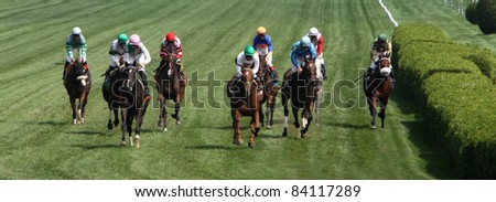 SARATOGA SPRINGS, NY -SEPT 3: Rajiv Maragh (green cap, center) guides Sugar Again to victory in the Paris Opera Stakes at Saratoga Race Course on Sept 3, 2011 in Saratoga Springs, NY.