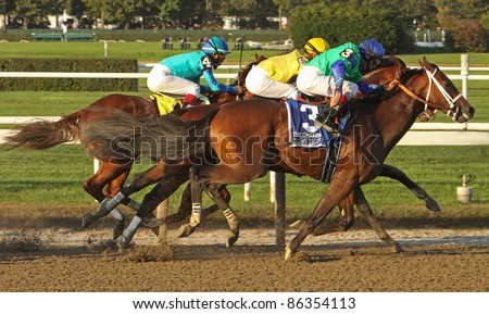 ELMONT, NY - OCT 8: Jockey Javier Castellano (yellow cap) moves between horses to guide \