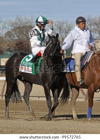 JAMAICA, NY - APRIL 7: Street Life and jockey Junior Alvarado enter the track for The Wood Memorial at Aqueduct Race Track on April 7, 2012 in Jamaica, New York.
