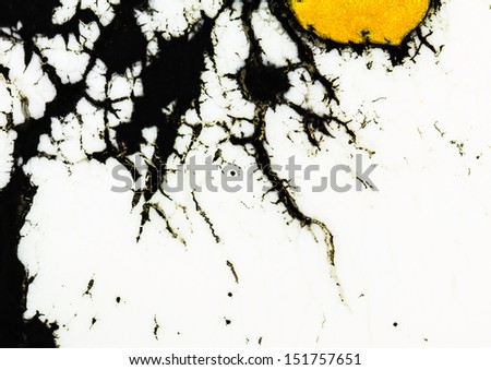 Gold glitter ink on black and white, abstract background