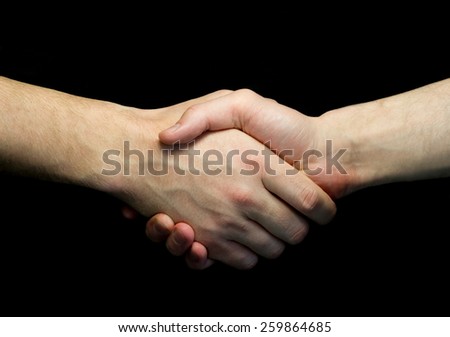 Two man shaking hands isolated on dark background