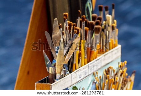Art supplies concept. Different all size paint brushes and spatula for sale