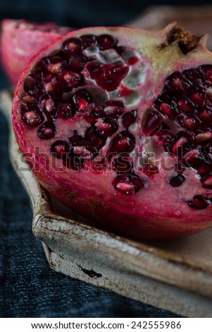 Pomegranate fruit cut with seeds