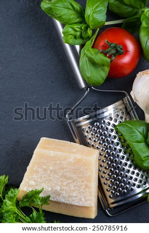 Selection of italian tipical food on black background from above