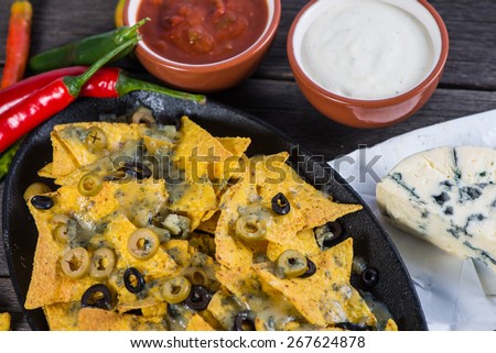 mexican hot street food nachos with salsa dip from above