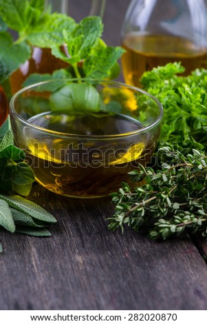 Fresh herbs from garden with olive oil, seasoning background