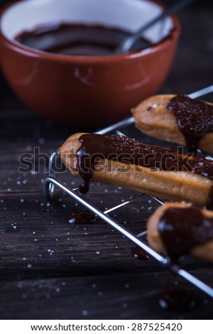 Fresh churros with melting chocolate dip on cooling tray