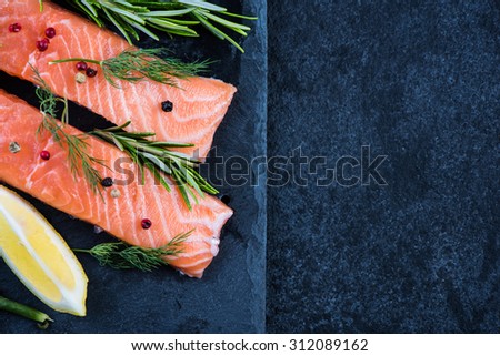salmon steaks with herbs, food background with copy space
