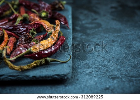 Dried vibrant hot peppers, food background with copy space