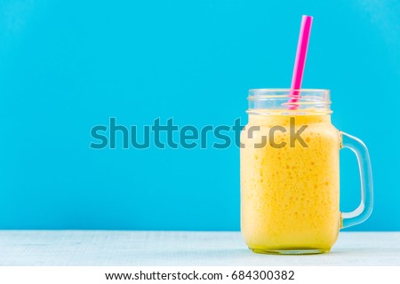 Similar – Foto Bild Mango-Smoothie auf blauer Farbe. Sommerliches Getränk. Mangoshake mit Strohhalm